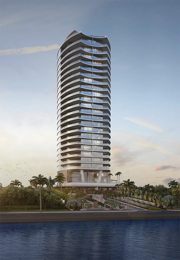 A modern waterfront high-rise tower surrounded by palm trees at sunrise in West Palm Beach.